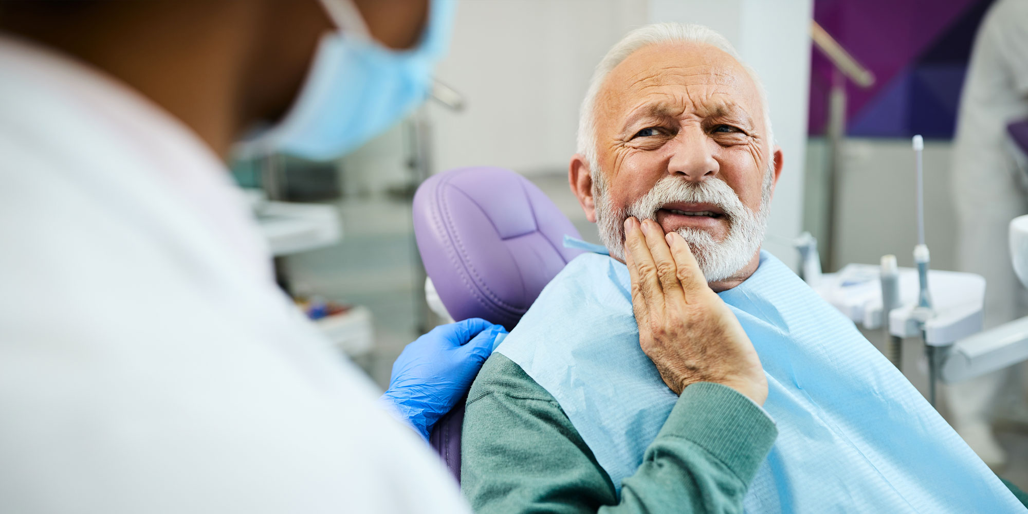 patient with peri implantits in pain from implant failure
