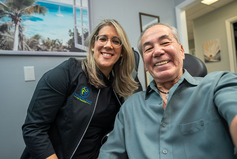 Dr. franco and patient smiling together
