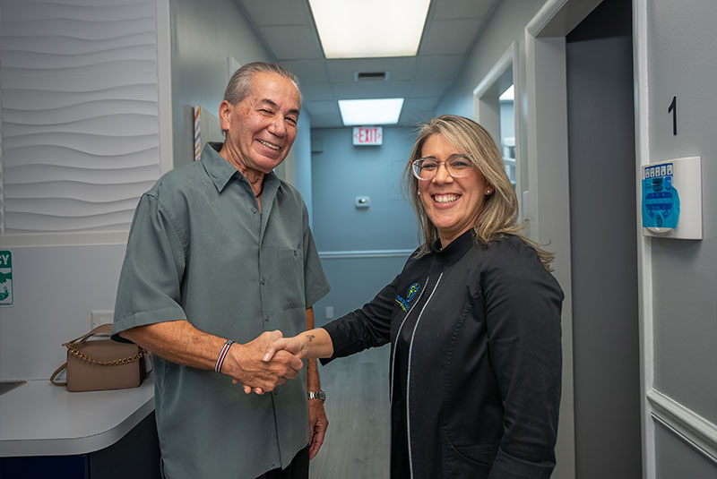 Dr. Franco shaking patients hand