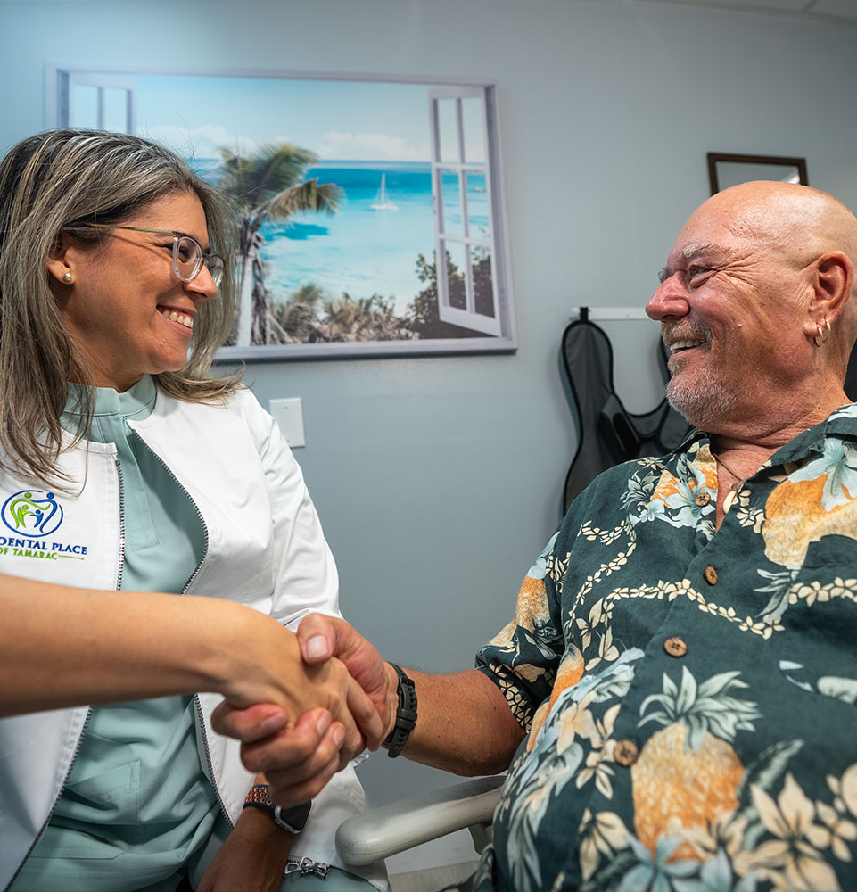 dr. Franco having a follow up with a dental implant patient