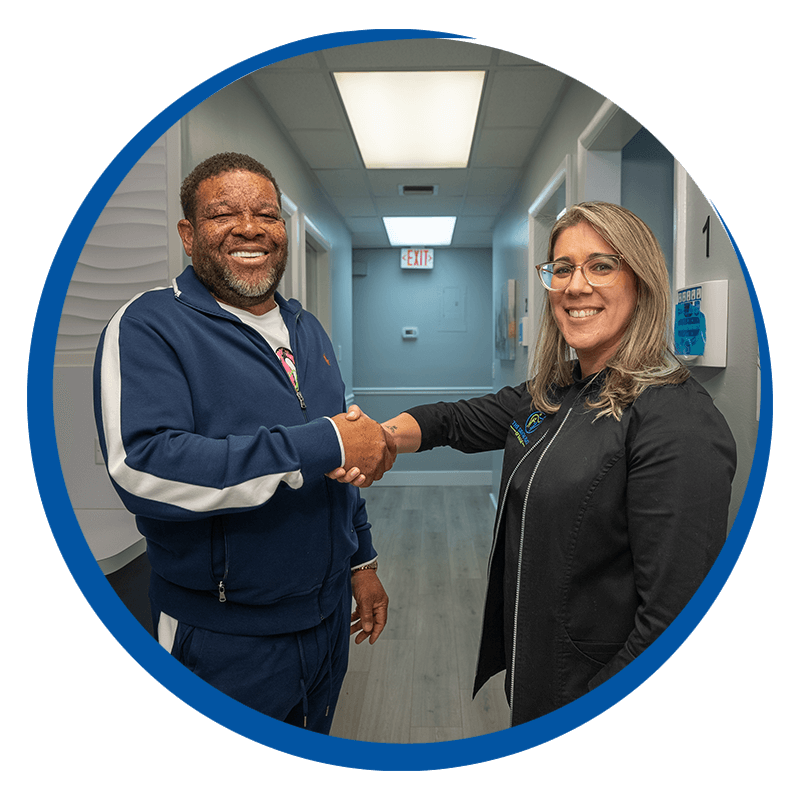 Dr. Franco shaking hands of a full mouth dental implants